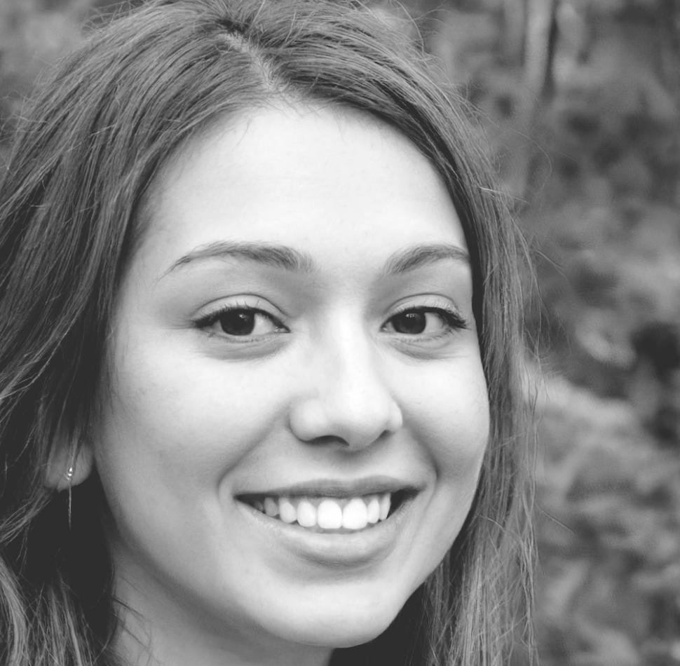 Instructor Lishan Pang reviewing market trends with students